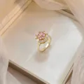 Elegant rotating bauhinia flower ring with pink zircon in golden titanium steel - Pink Zirconia Octagonal Rotating Ring (J0761) / Gold