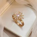 Elegant golden sunburst ring featuring a central sparkling zircon stone for women - Sunflower Rotating Ring (J0337) / Gold