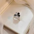 Elegant flower ring with black enamel and white zirconia petals in silver finish - Clover Rotating Ring (J0358) / Silver