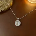 Eleganter silberner rotierender Halskette mit rundem Katzenauge und Zirkon-Pavé-Details. - Halskette (X00064--2) / Stahlfarben