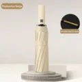 Portable sycamore beige folding umbrella with reinforced double rib frame for sun and rain - Indus Rice