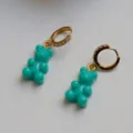 Close-up detail of teal gummy bear drop earrings with gold-plated zirconia hoops. - Bear Style / Single Piece / Blue