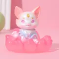 Close-up view of a pink resin fox figurine in a lotus flower base - Shanhai Fox Style B Pink
