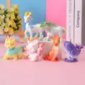 Collection of Chinese mythical beast figurines in pastel gradient colors on pink background - Ancient Mythical Beasts Single Random Box