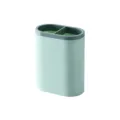 Green plastic desktop pen holder with dual compartments for office and school stationery. - Light Green