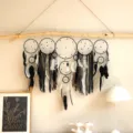 Attrape-rêves mural en plumes noires et blanches fait main décoration style bohème chic - Noir