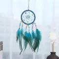 Blue handmade dream catcher hanging ornament with colorful beads and feathers for home decor. - Blue
