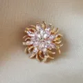 Exquisite gold-tone floral brooch with shimmering pink marquise-cut crystal petals - Pink