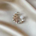 Elegant golden insect-themed brooch with white pearl and crystals on silk background - Bamboo Pearl Style (895) / Gold with Zirconia and Artificial Pearl