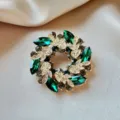 Exquisite green gemstone wreath brooch, gold-plated leaf rhinestone jewelry detail. - Green Wreath