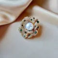 Luxury gold-tone camellia flower brooch with central pearl and green emerald stones - Layered Camellia Single Pearl Center Style (908)