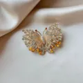 Detailed view of vintage butterfly brooch with amber rhinestones on silk - Classic Pavé Butterfly Style (905)