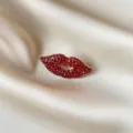 Elegant luxury red lip brooch with sparkling rhinestones on champagne satin background - Red Lips Pave Rhinestone Style (865) / Red Rhinestone