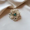 Elegant gold floral brooch with emerald green crystal and sparkling rhinestones - Emerald Blooming Flower Style (902) / Gold with Emerald Green Crystal