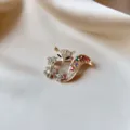 Elegant luxury fox brooch with colorful rhinestones on a smooth champagne silk background - Colorful Rhinestone Fox Style (892) / Gold Base Colorful Stones