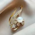 Macro view of elegant gold hollow brooch with white pearl and sparkling crystal accents - Pearl Flower Brooch (978#)