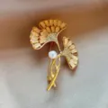 Elegant gold-toned ginkgo leaf fashion brooch featuring pearl and rhinestone accents. - Ginkgo