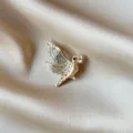 Elegant gold-tone bird brooch with sparkling rhinestones on soft champagne satin - Flying Bird with Letter Rhinestone Style (867) / Gold White Rhinestone