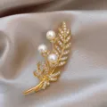 Exquisite gold pearl wheat brooch detail, sparkling zircon stones and elegant bow design. - Leaf Bow