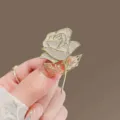 Elegant gold rose brooch with sparkling rhinestones, perfect for coats and outfits. - Full Diamond Rose / Gold