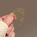 Gold metal wireframe rose brooch or hair clip, elegant vintage style fashion accessory. - Hollow Rose / Gold