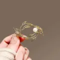 Elegant gold hollow fish pearl brooch fashion coat accessory exquisite jewelry gift for women - Pisces / Gold