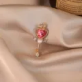 Elegant golden heart brooch with pink crystal and pearl, niche designer fashion accessory - Magic Wand / Gold