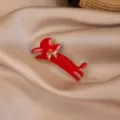 Elegant red enamel dachshund brooch with gold bow, chic fashion coat accessory for women. - Cat / Red