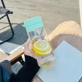 Portable plastic water bottle with mint green lid, stylish minimalist daily drinking cup. - Transparent Style / 600mL / Light Green