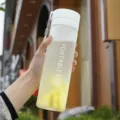 Frosted plastic water bottle with portable lanyard for outdoor sports and travel use daily. - Matte White