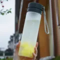 Frosted plastic portable sports water bottle with handy strap for outdoor travel and daily use. - Matte Black
