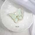 Elegant butterfly brooch with pearl detail, 4cm width shown on white plate - Green Butterfly Style (#32) / Green