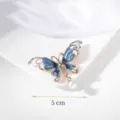 Detailed view of elegant blue butterfly brooch with pearl charm, 5cm size dimension. - Blue Butterfly Style (#34) / Blue
