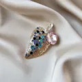 Elegant gold-toned leaf brooch featuring a large pink crystal and multi-colored rhinestones - Pink Gem Leaf Style (854) / Gold/Pink