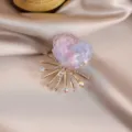 Exquisite colorful flower crystal brooch with rhinestone rays, elegant silk background detail. - Light Purple
