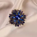 Close-up detail of vintage blue crystal floral brooch, exquisite alloy setting for women fashion. - 648# Blue Flower