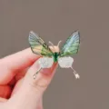 Elegant green butterfly brooch with sparkling crystals and an emerald-colored center stone - Green Vivid Butterfly Style (#117)