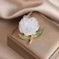 Exquisite peony flower brooch with sparkling green rhinestone leaves and delicate translucent petals. - White