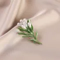 Elegant green plant brooch with white pearl droplets on soft silk fabric background - Green Leaf Pearl Bouquet (677#)