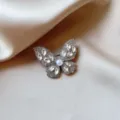 Elegant rhinestone pearl butterfly brooch, exquisite accessory for women's suits & shawls. - Silver