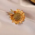 Detailed macro shot of a vintage baroque sunflower brooch with a crystal-encrusted bee - Sunflower Bee / Gold