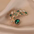 Vintage emerald green crystal peacock brooch, exquisite metallic detailed fashion accessory. - Peacock / Gold