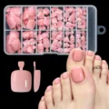 Detailed view of glossy nude pink press-on toe nails with foot model demonstration - 120Pcs Solid Glossy Nude Pink