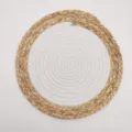 Top view detail of a round two-tone placemat woven from cotton rope and natural straw - 20cm / White