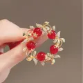 Elegant gold-tone red berry wreath brooch for women, sparkling crystal leaf jewelry accent variant. - Red Circle Geometric