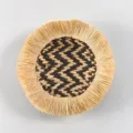 Bohemian round straw woven wall hanging with fringed edge and chic black tan pattern decor. - C5