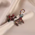 Detailed macro view of a cartoon enamel cat brooch with colorful heart patterns - Coffee Cat / Coffee