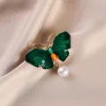 Elegant green enamel butterfly brooch with dangling pearl, vintage gold tone clothing accessory. - Pearl Green Butterfly / Green