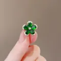 Elegant small flower-shaped brooch with green gemstones and golden metal trim accents - Green Five-Leaf Clover (125#)