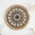 Detailed view of the intricate woven texture and fringe on this round jute decorative placemat. - Tassel Style 4 / 38 cm